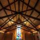 High, wood deck ceilings and exposed rafters extend the Chapel skyward.