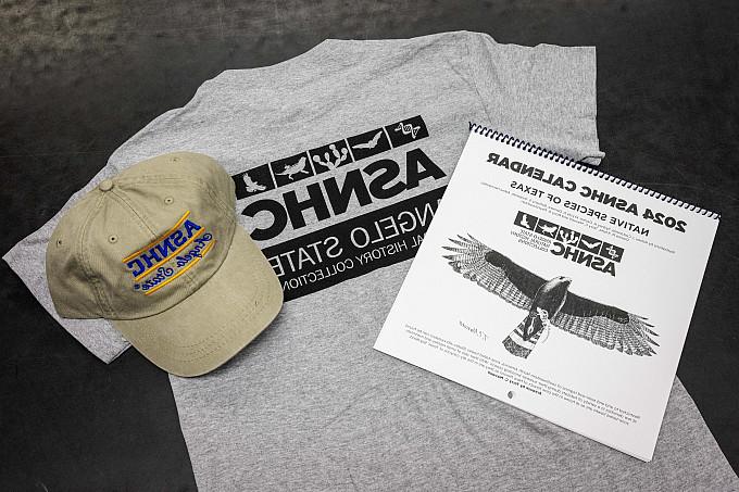 A calendar, hat, and tshirt with the ASNHC Logo
