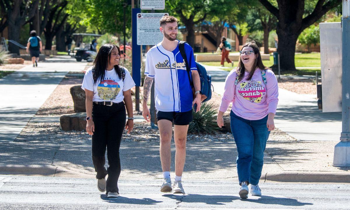 Students walking and talking on campus